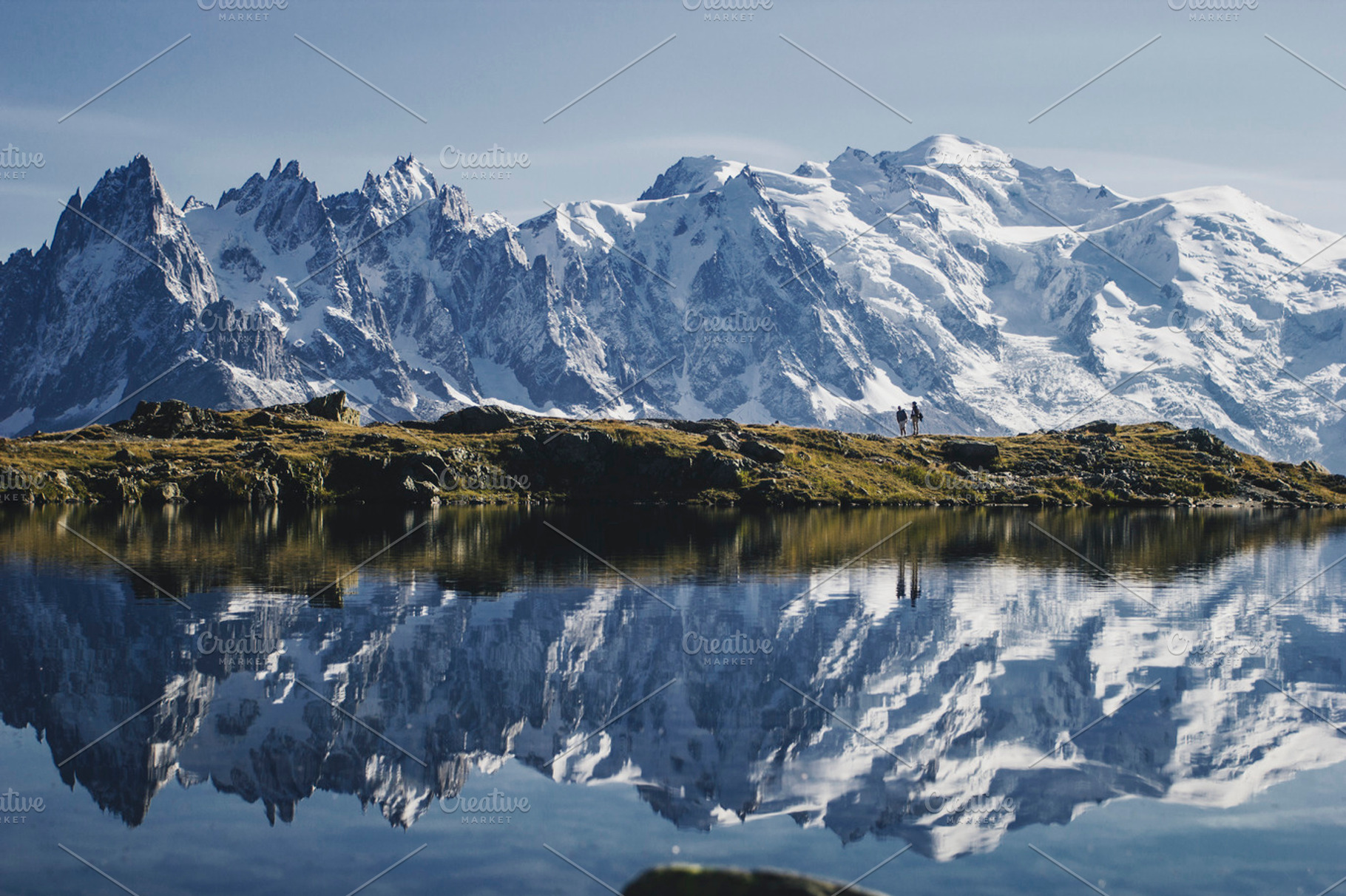 Couple on a lake in the alps containing mountain, view, and hike, a Nature Photo by Mukuko Studio