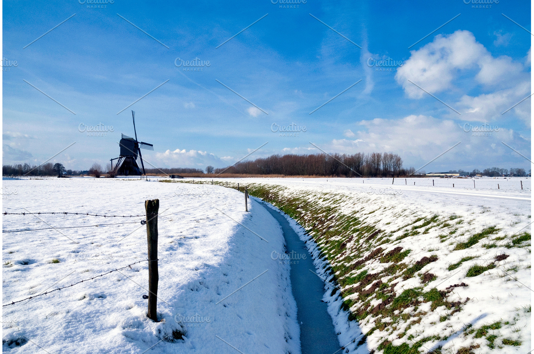 Windmill in winter, a Nature Photo by John Stuij Photography