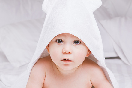 Adorably baby lie on white towel in bed happy childhood and healthcare, a Person Photo by fotoliza