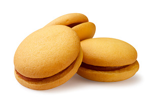 Round sandwich cookies with cream on, a Food & Drink Photo by innakreativ