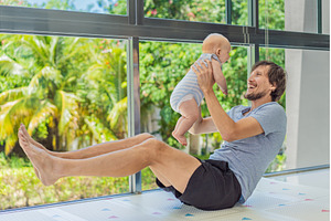 Father exercising with his small, a Sports & Recreation Photo by Elizaveta Galitskaya