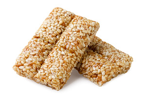 Two pieces of kozinaki with sesame, a Food & Drink Photo by innakreativ