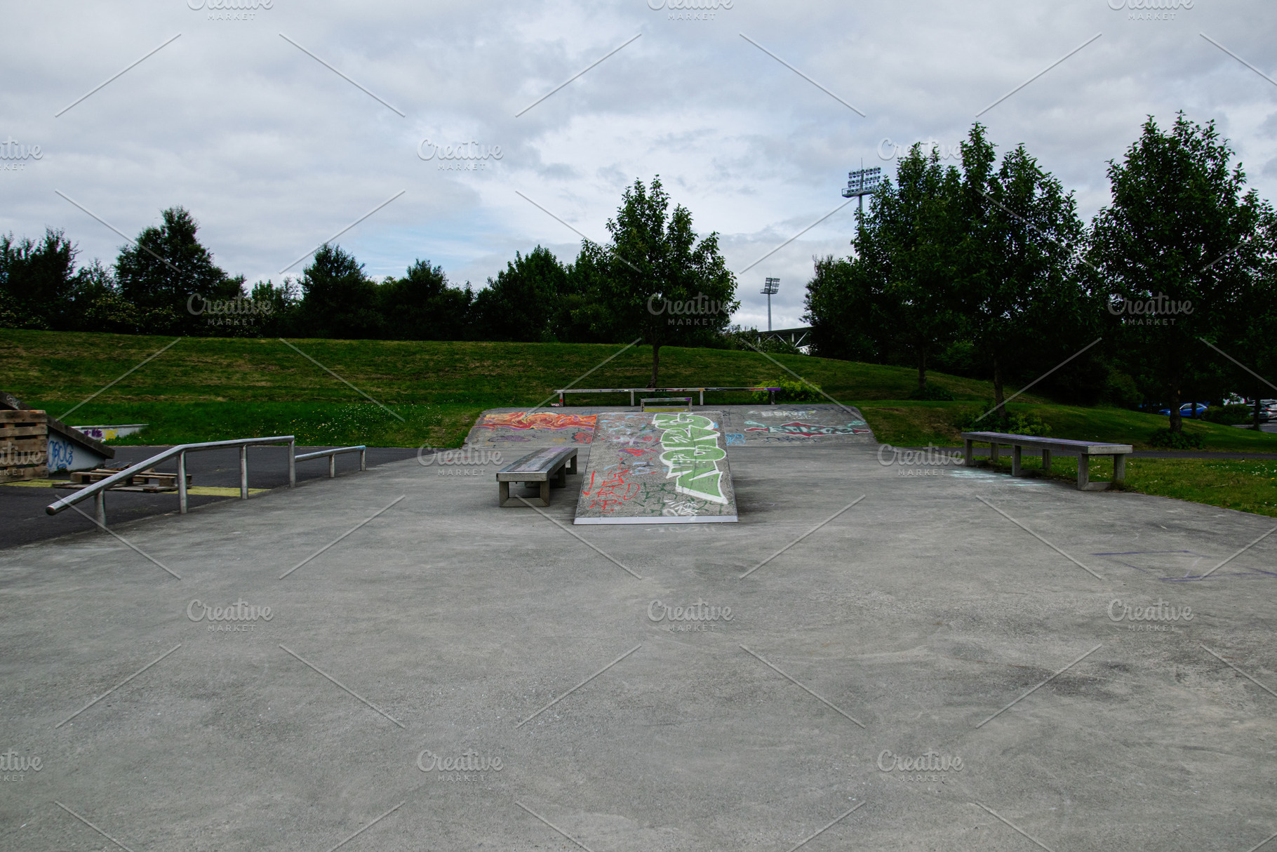 Urban skate park in Reykjavik, Iceland surrounded by greenery and open space, a Photo by AS photostudio