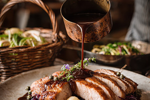 Roasted pork tenderloin with red cab, a Photo by Pixeness Studio