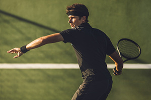 Tennis player playing on hard court stock photo containing athlete and ball, a Sports & Recreation Photo by Jacob Lund