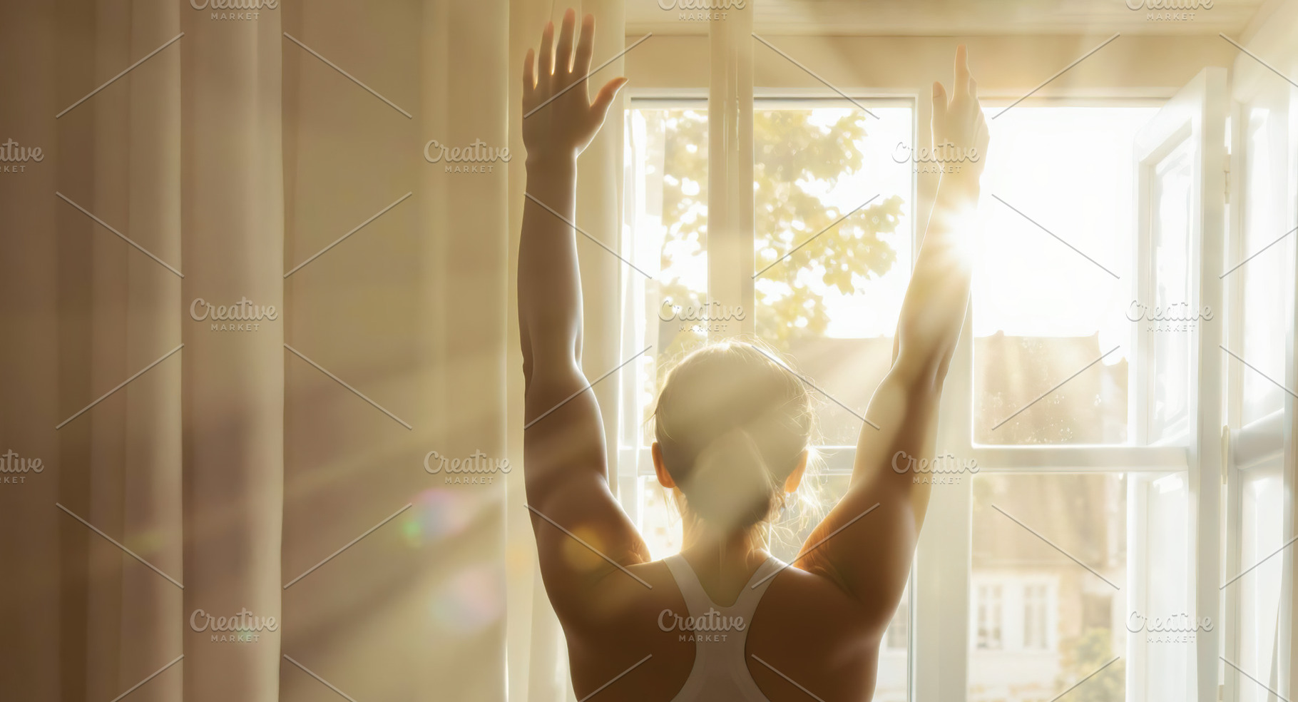 Woman stretching in front of a windo, a Person Photo by Perpis