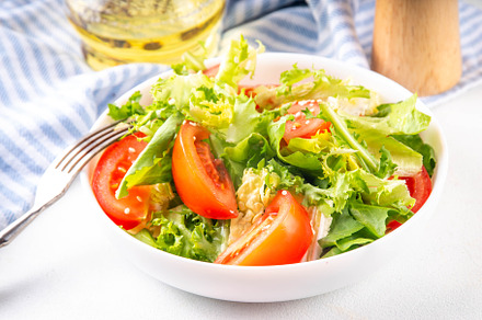 Vegetable salad with lettuce and sliced tomatoes, a Photo by Rimma