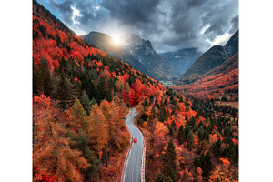 Aerial view of winding mountain road, a Nature Photo by den-belitsky