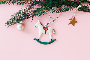 Happy New Year 2026 ! Horse christmas toy on pink flat lay with, a Holiday Photo by Sonjachni