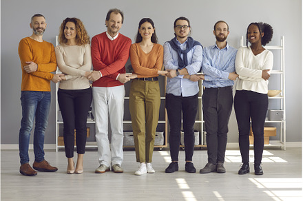Happy multiethnic people holding, a Person Photo by StudioRomantic