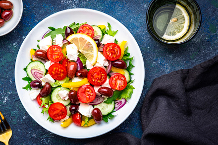 Tasty Greek salad with feta cheese, kalamata olives, tomatoes, p, a Food & Drink Photo by 5PH