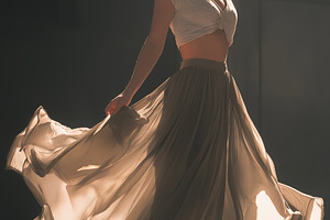 Woman in Beige Skirt Twirling, a Person Photo by Ocean Digital Art