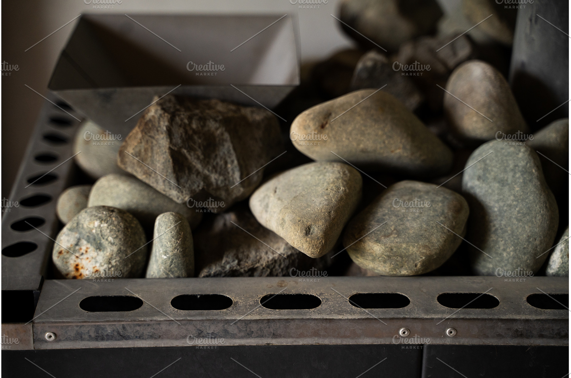 Smooth and rough sauna stones, an Architecture Photo by volodymyrshtun13795