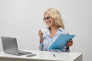 Business lifestyle. Happy office worker drinking coffee, working with documents, a Photo by Prostock-Studio (Thumbnail 2 of 2)