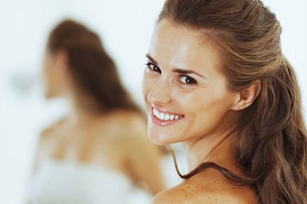 smiling young woman in bathroom, a Person Photo by Alliance Images