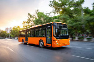 Modern city bus driving at sunset, a Transportation Photo by AlyaAnd