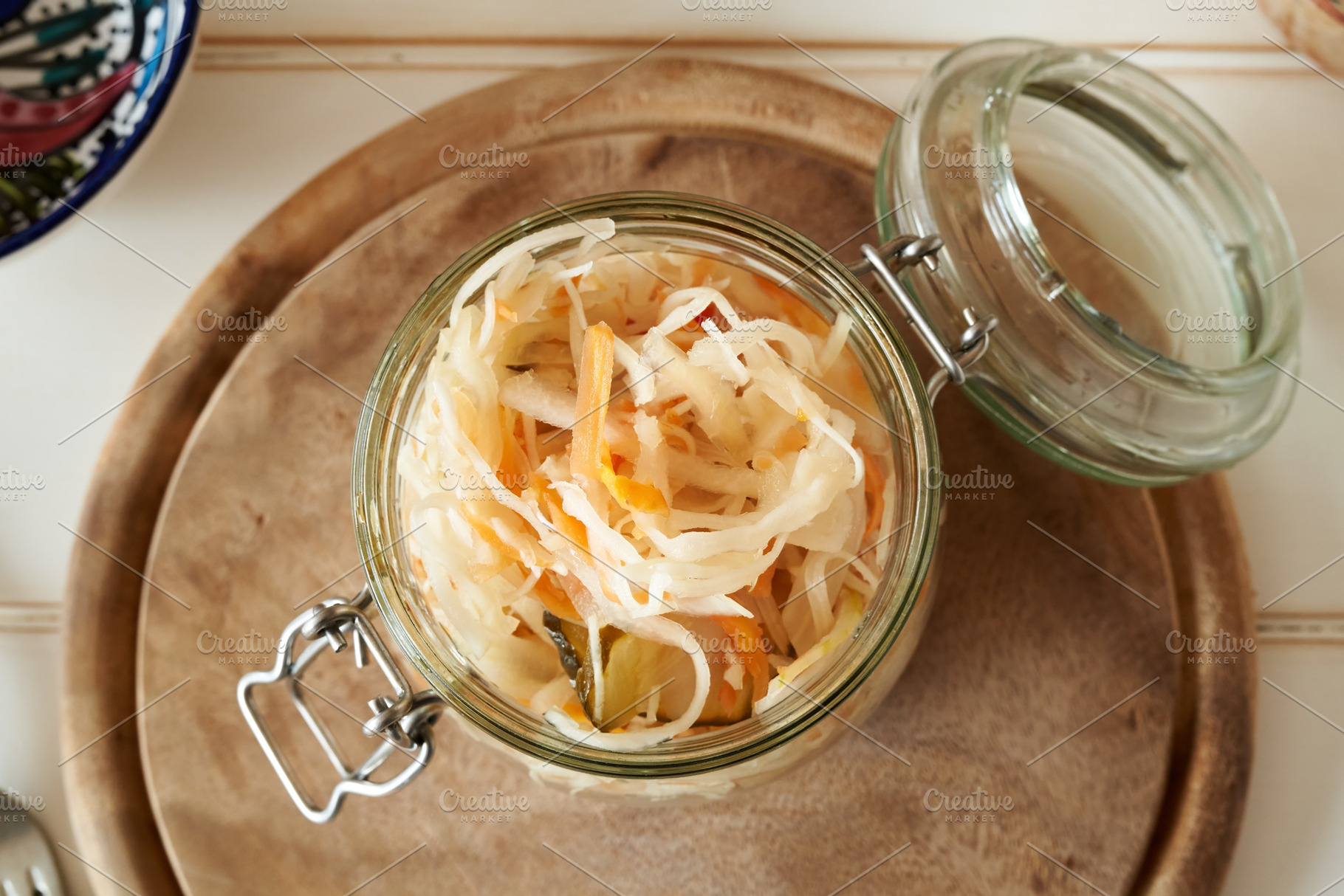 Fermented cabbage with carrots in a jar, a Food & Drink Photo by Madeleine Steinbach