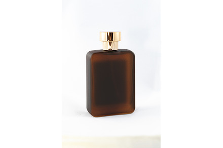 Brown Matte Bottle of Perfume for, a Background Photo by InfinitumProdux