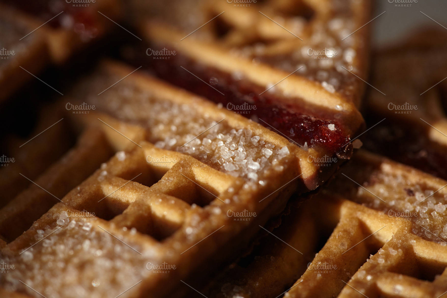 Sweet house-shaped cookies decorated with sugar and red fruit jam., a Food & Drink Photo by Rohan Photography