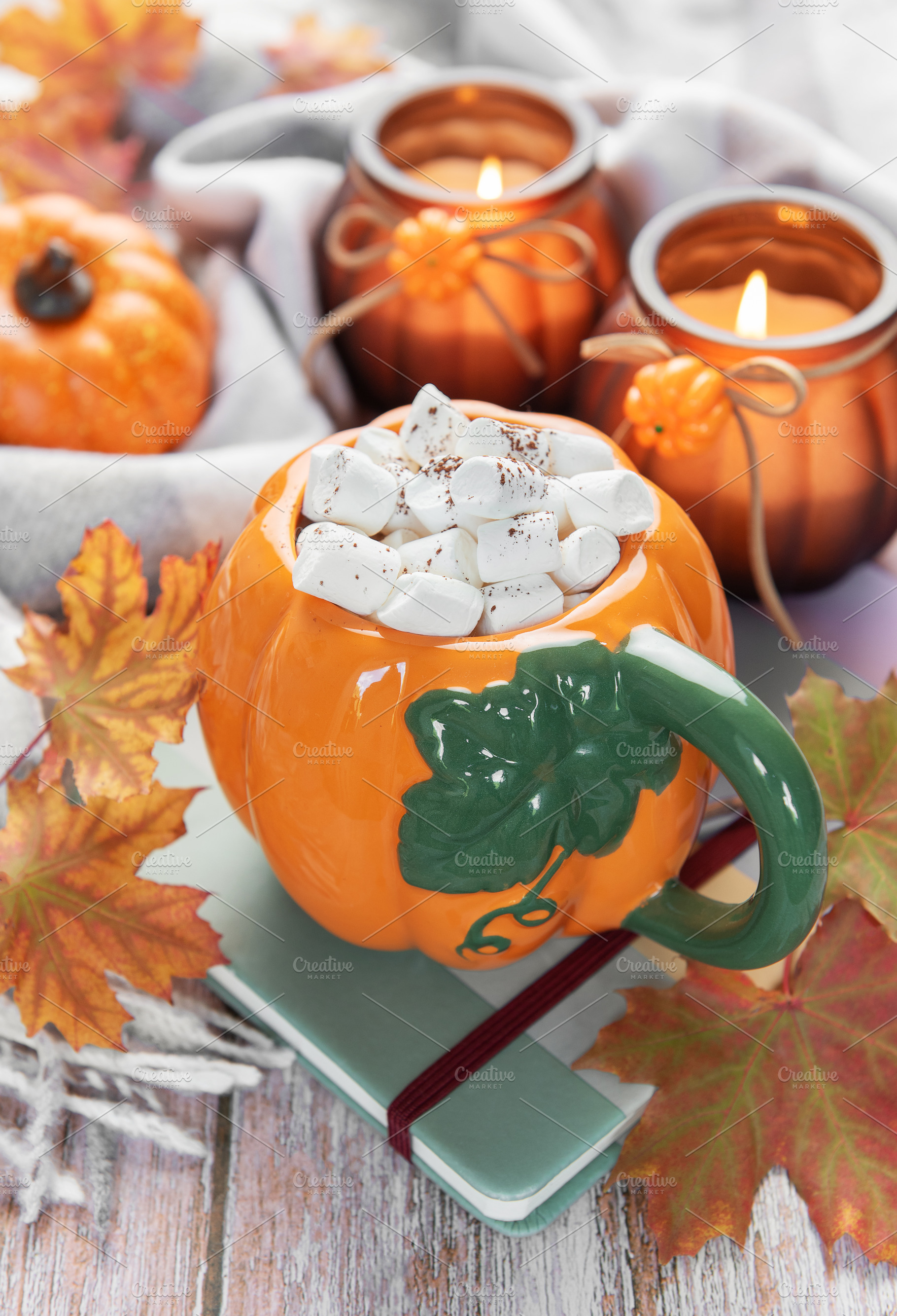 Hot cocoa in pumpkin mug on rustic table, a Food & Drink Photo by Olena Rudo