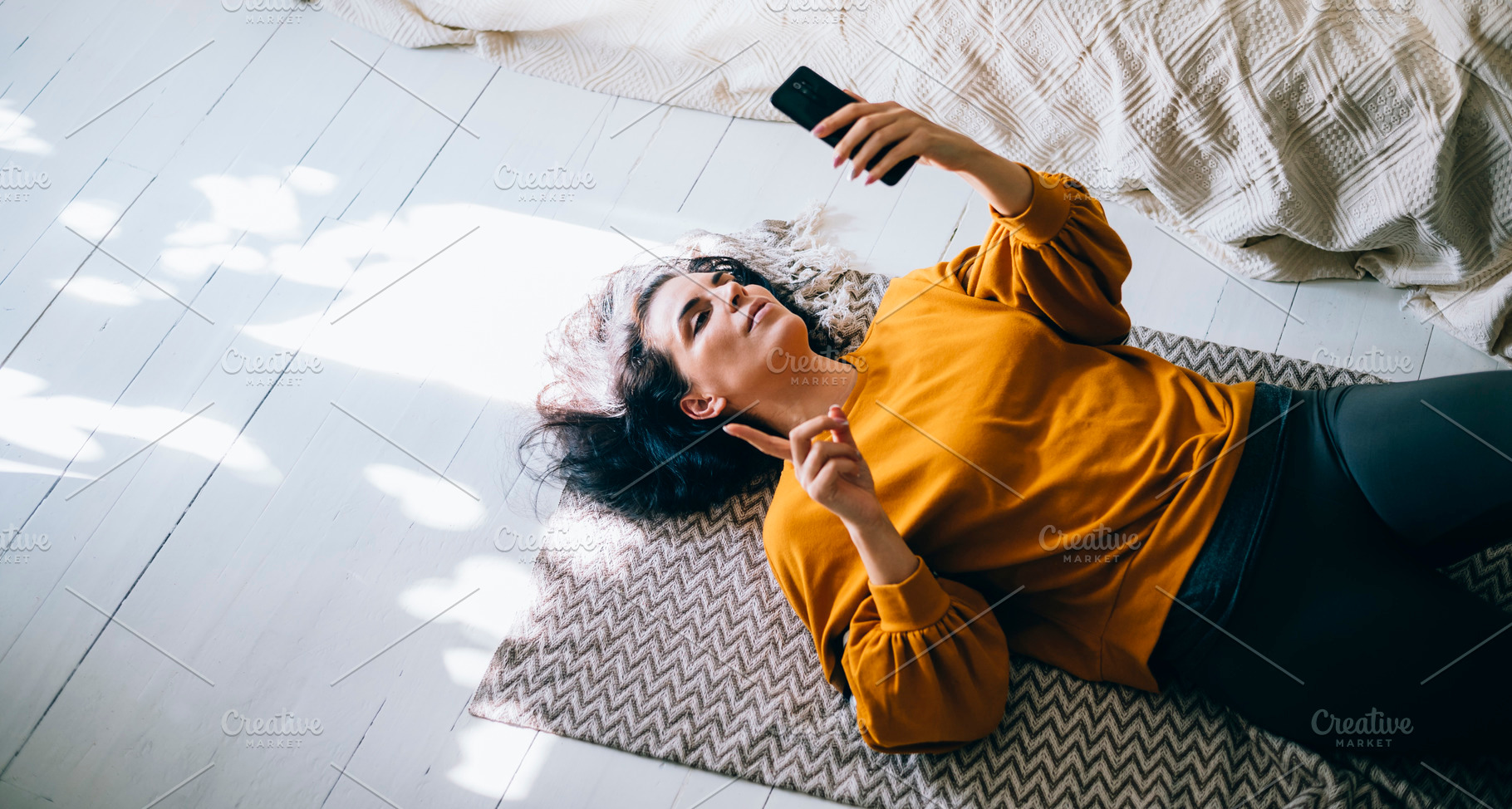 Woman lying down floor in livingroom, a Person Photo by hitdelight