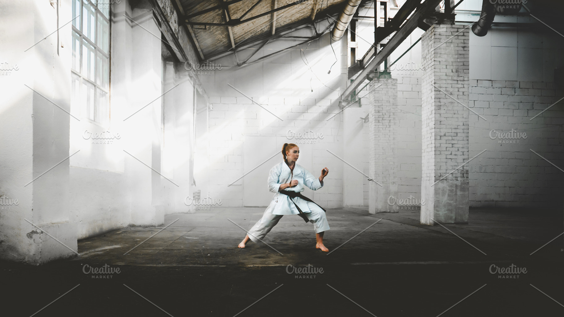 Female practicing karate containing karate, martial, and art, a Sports & Recreation Photo by supamotion