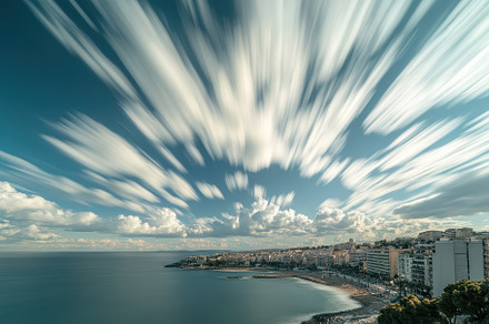 Clouds billow gracefully over coasta, a Photo by Iftikhar Alam