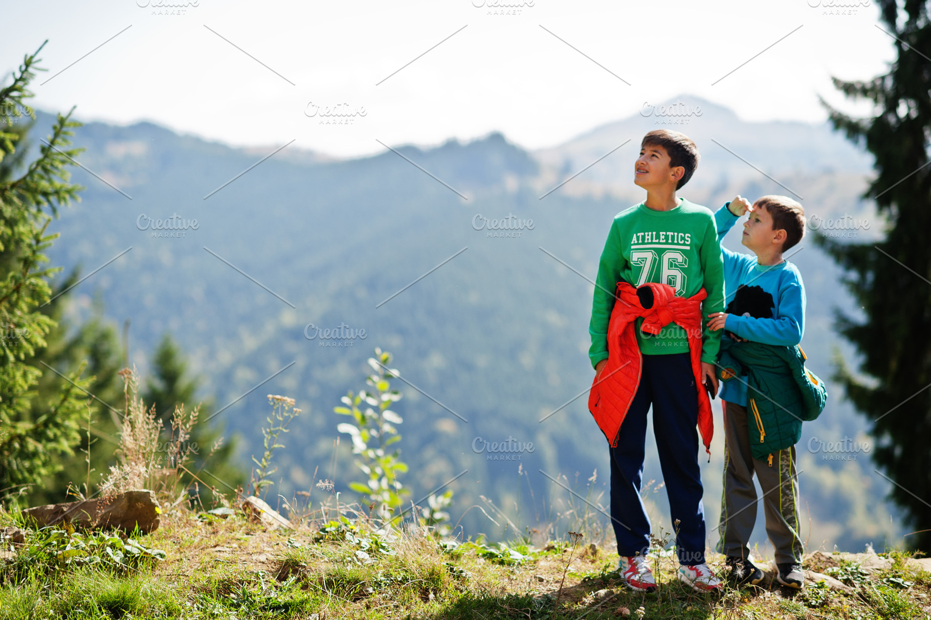 Brothers hike in the mountains, children are walking along a mou, a Person Photo by AS photostudio