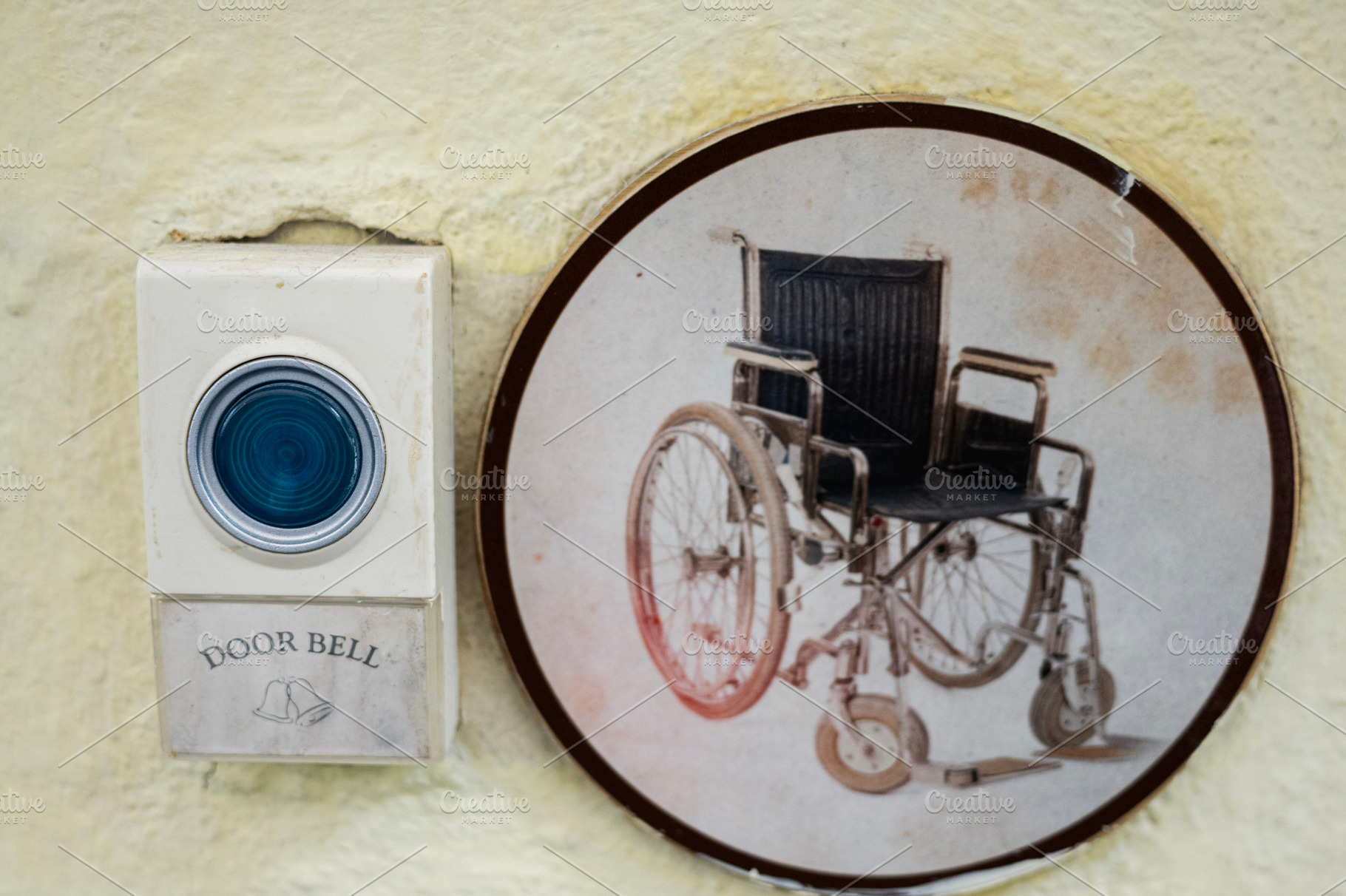 Doorbell with wheelchair symbol highlighting accessibility for people with disa, a Photo by AS photostudio