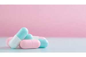 Pastel colored capsules on pastel, a Health & Medical Photo by Lermont51