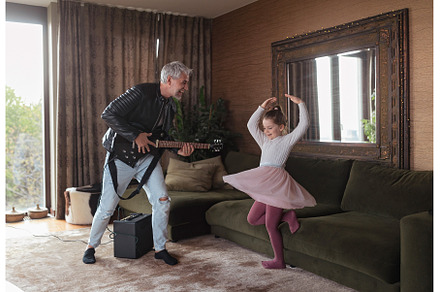 Father rock guitarist having fun and, a Person Photo by HalfPoint