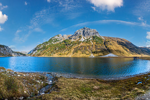 Sunny autumn alpine Tappenkarsee lake and rocky mountains above,, a Nature Photo by YuriyB