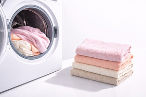 Laundry with stack of soft towels ne, a Photo by Dvoevnore photos