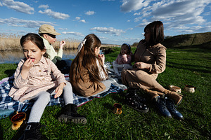 Family picnic by the lake with mother and children enjoying a sunny spring afte, a Person Photo by AS photostudio