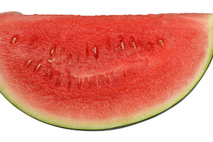 Triangular piece of ripe watermelon with juicy red flesh, a Food & Drink Photo by ndanko