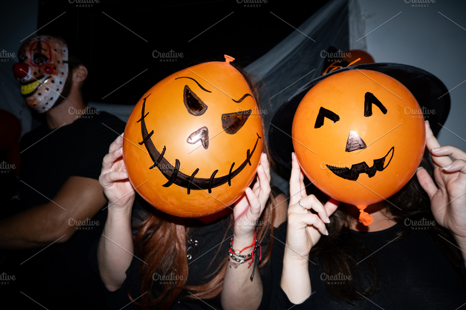 Friends posing with pumpkin balloons at Halloween party, a Holiday Photo by etorres69