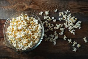 Pop corn on wood color background.Food and snack concepts ideas.Minimal style t, a Food & Drink Photo by Budarinphoto