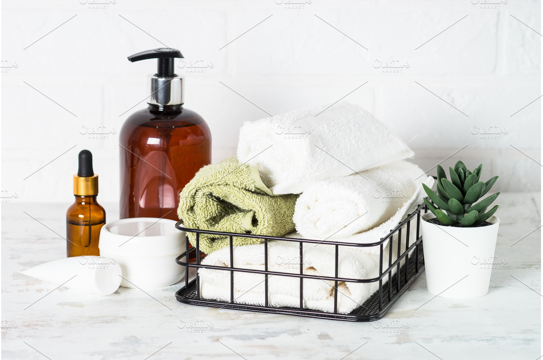 Bottle of soap and stack of towels, a Health & Medical Photo by Nadia-nb