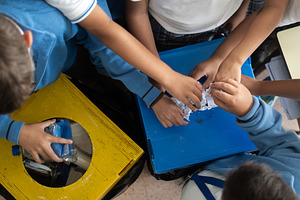 Elementary School Students Learning to Recycle Plastic Bottles, a Person Photo by etorres69