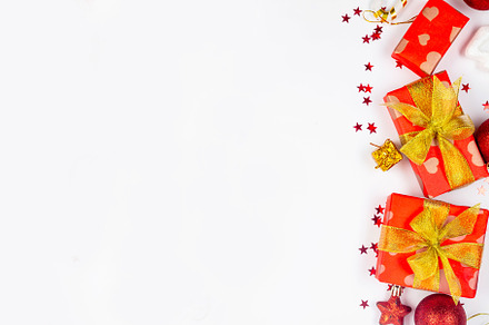 Red and gold christmas baubles, red gift boxes at white backgrou, a Holiday Photo by vimart