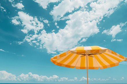 Yellow Striped Beach Umbrella Against Blue Sky, an Abstract Photo by Natalia Klenova's Shop