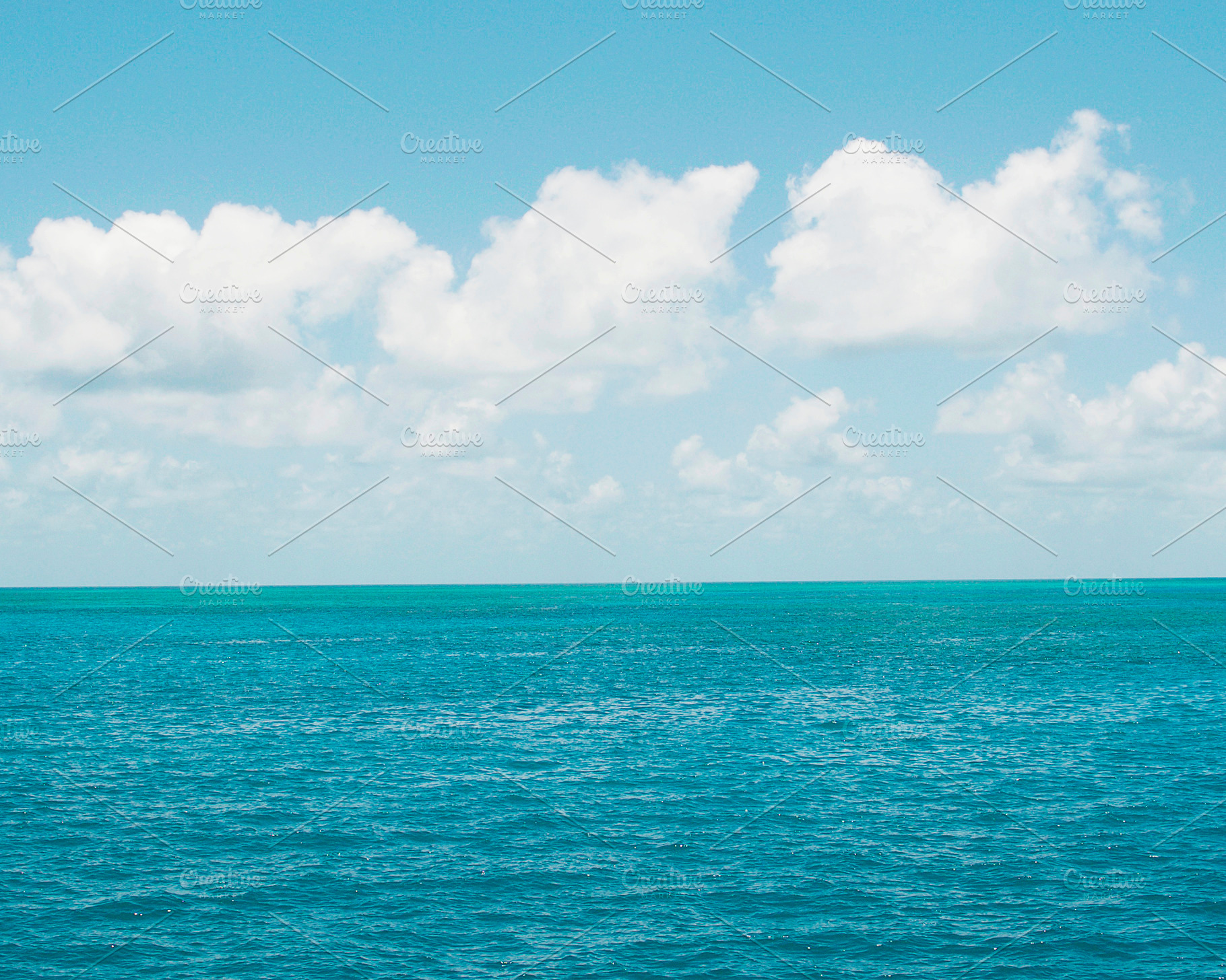 Blue Ocean White Clouds Stock Photo, a Nature Photo by Dee Andreoli Photography