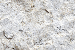 Textured limestone stone surface with a rough, uneven appearance. The color is, a Texture Graphic by Textures & Backgrounds