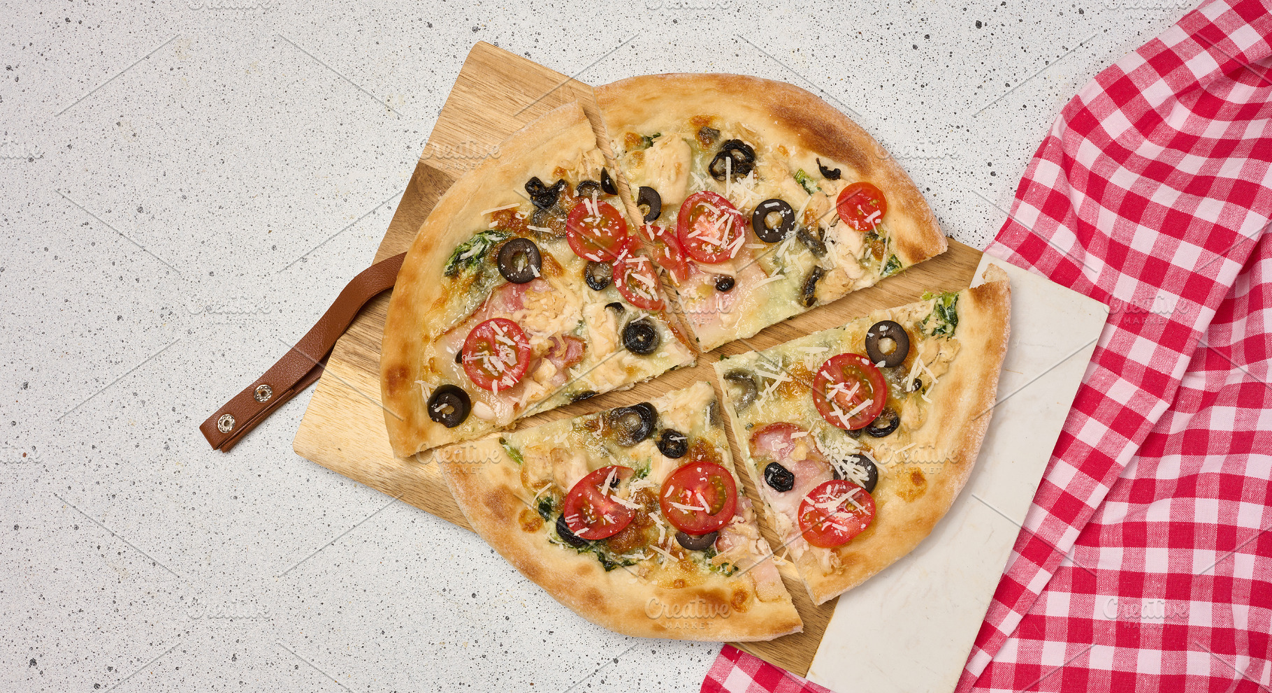Appetizing pizza cut into pieces on a round white plate with tom, a Food & Drink Photo by ndanko
