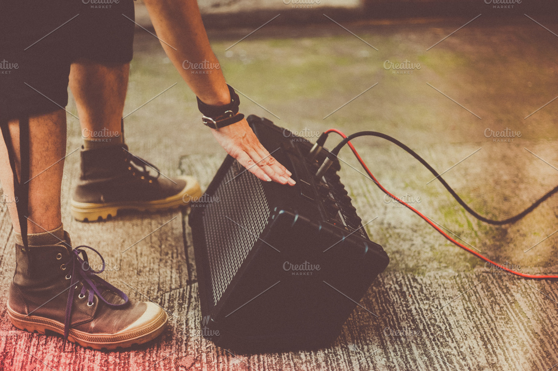 Guitar amp containing jazz, outdoor gig, and music, a Person Photo by The Kandid