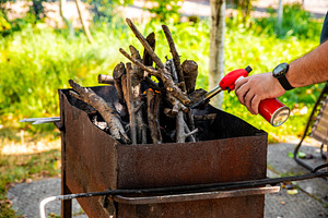 Lighting Outdoor Barbecue Grill, a Holiday Photo by Ales Munt