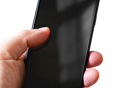Hand holding a smartphone with blank black screen. Isolated on w, a Technology Photo by GoodGoods