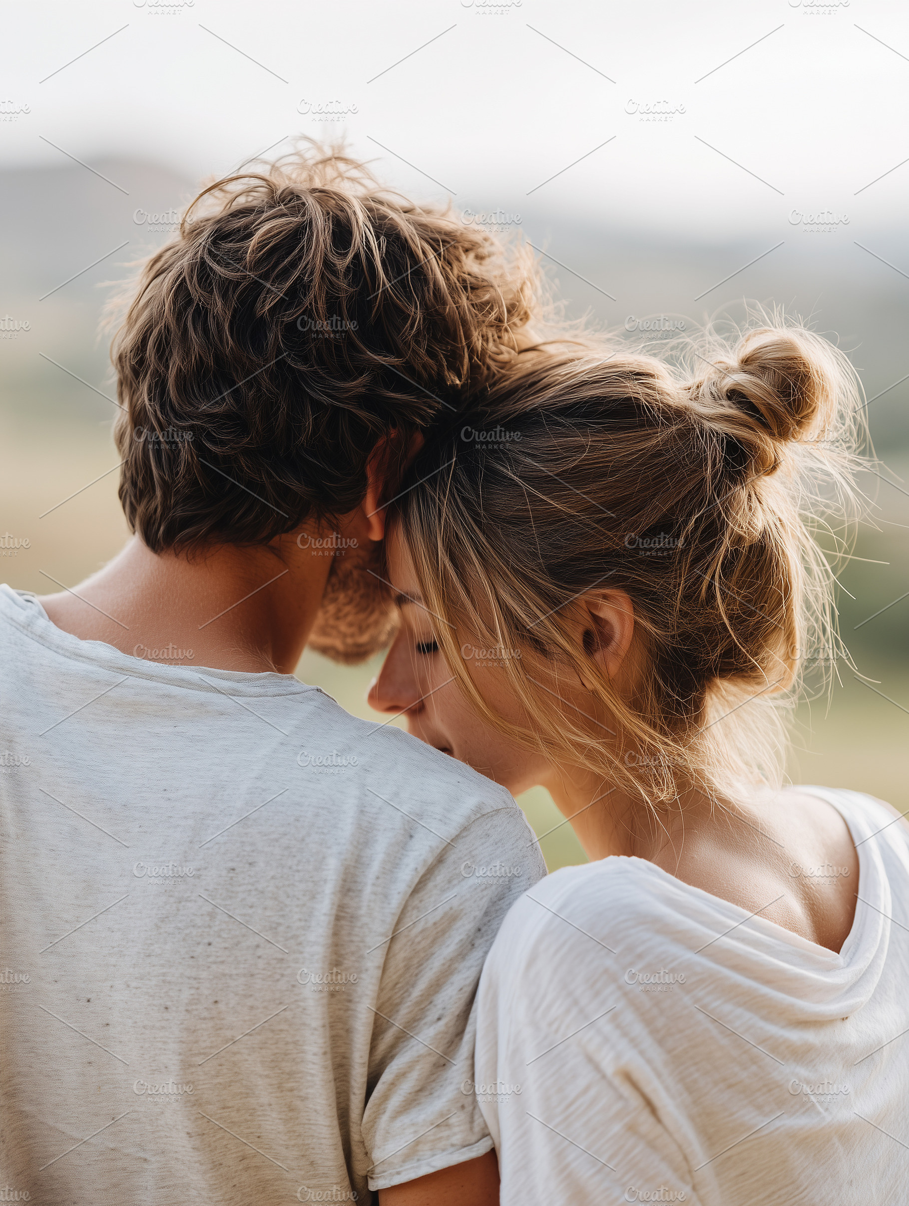 Young couple embracing outdoors with, a Person Photo by MistyDay
