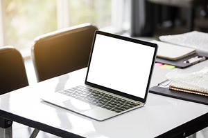 Mock up of laptop on the table in th