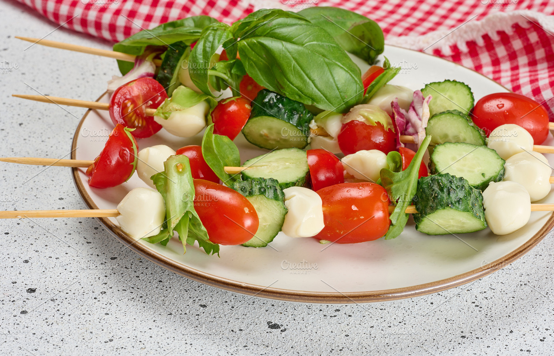Appetizer of fresh vegetables and cheese on wooden skewers, a Food & Drink Photo by ndanko